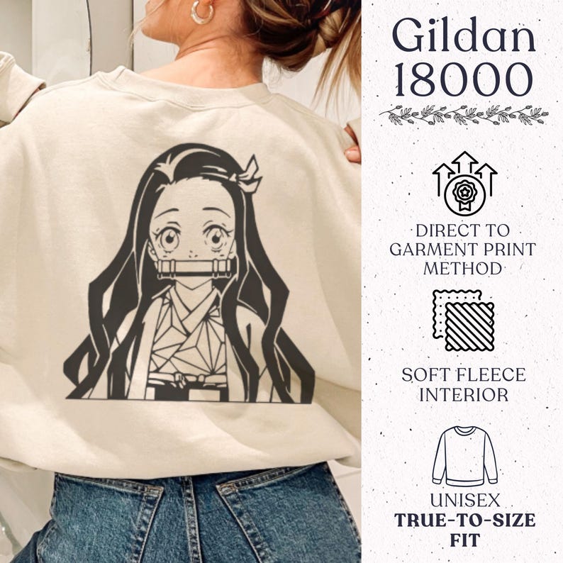 May include: A beige crewneck sweatshirt featuring a dark brown graphic of an anime character with long hair and a bamboo muzzle. The right side displays text: Gildan 18000, Direct to Garment Print Method, Soft Fleece Interior, and Unisex True-to-Size Fit.