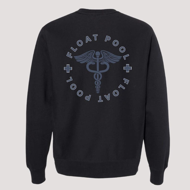 May include: A black long-sleeve sweatshirt featuring a circular graphic on the back. The design includes the text FLOAT POOL in a circular arrangement, two small cross symbols, and a central caduceus emblem in a muted blue-gray color.