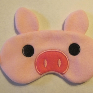 May include: A set of three ceramic mugs with a speckled, matte finish. The mugs are in shades of cream, light gray, and dark gray. Each mug has a simple, minimalist design and a rounded handle. The mugs are stacked on top of each other.