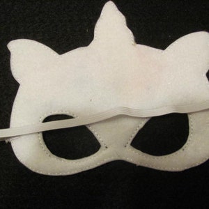 May include: White felt unicorn mask with black eye holes and an elastic band.