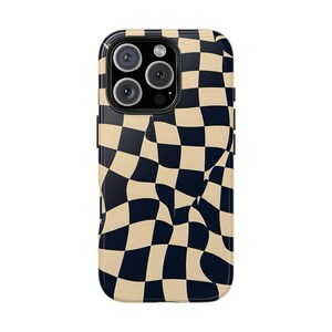 May include: A black and beige checkered phone case with a wavy pattern. The case has a cutout for the phone's camera lenses.