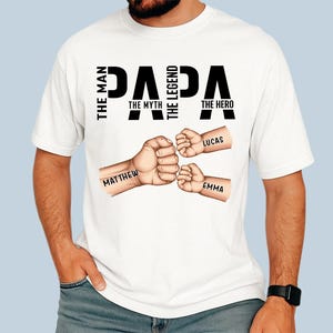 Custom Papa Shirt with Kid Fist Bump – Grandpa The Man The Myth T-Shirt – Personalized Father&#39;s Day Gift Shirt, Grandfather Shirt, Papa Gift