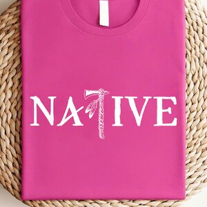 a pink t - shirt with the word native printed on it