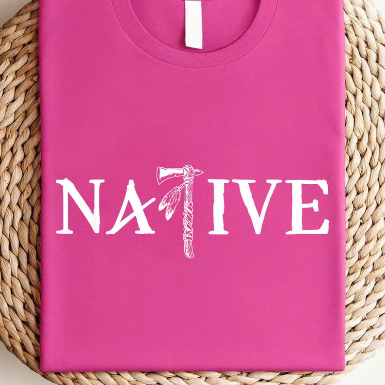 a pink t - shirt with the word native printed on it