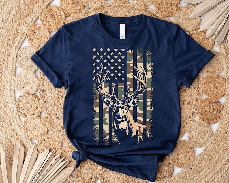 A navy blue t-shirt with a graphic design featuring a deer head and an American flag pattern.