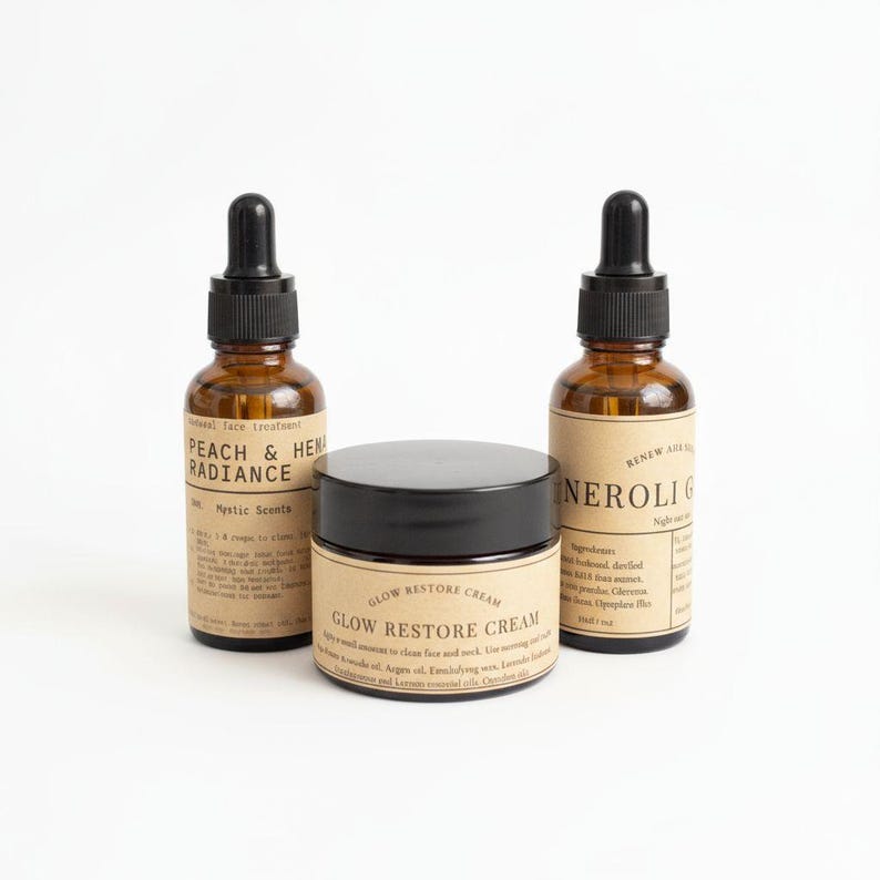 May include: Three skincare products: two amber glass dropper bottles and a jar with a black lid. The bottles are labelled "PEACH & HEN RADIANCE" and "NEROLI G". The jar is labelled "GLOW RESTORE CREAM".