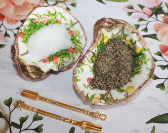 Oyster salt and pepper cellars with gold toned spoons make a unique Housewarming or table decor gift. Elevate your table setting!