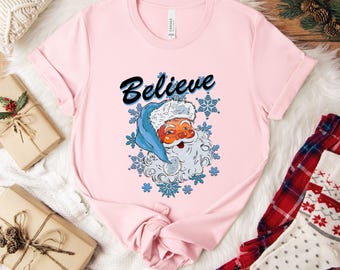 Santa Believe Christmas Shirt, Believe Holiday Tee, Cute Santa Graphic Shirt, Festive Winter Tee, Christmas Gift for Her, Cozy Xmas Shirt
