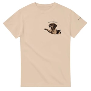 May include: A beige t-shirt featuring a brown and white dog illustration and the text "What's your point?" printed on the front.