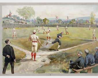 May include: A framed vintage baseball print with a gold frame. The print depicts a baseball game in progress, with players in period uniforms on a green field. Spectators are seated in the background. Decorative gold vases are in the foreground.