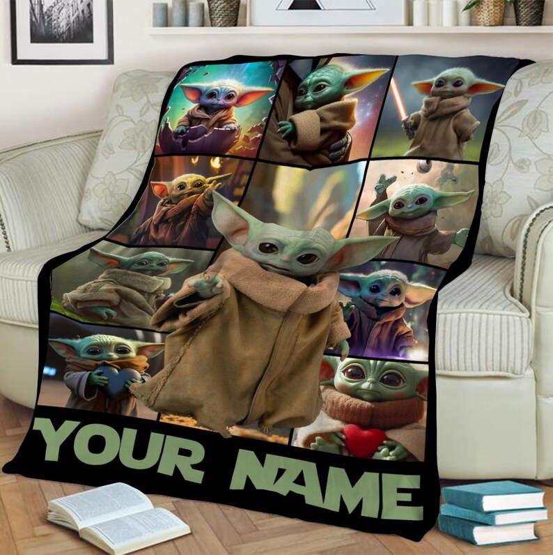 May include: Black blanket featuring multiple images of a green alien character with large ears and brown robes. The blanket has the text "YOUR NAME" in green letters at the bottom.