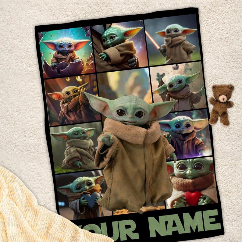 May include: A black blanket featuring multiple images of a green alien character with large ears and a brown robe. A small brown teddy bear is on the right side of the blanket. The text "YOUR NAME" is at the bottom.