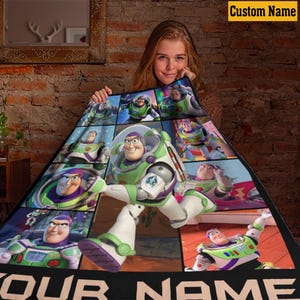 May include: A fleece blanket featuring a collage of Buzz Lightyear from Toy Story in various poses. The design includes multiple panels of the character in his signature white, green, and purple space ranger suit. The text Custom Name is at the top.
