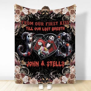 May include: A black throw blanket featuring a floral border and the text FROM OUR FIRST KISS TILL OUR LAST BREATH. It displays a heart containing two animated characters, flanked by large letters J and S, with the names JOHN & STELLA below.