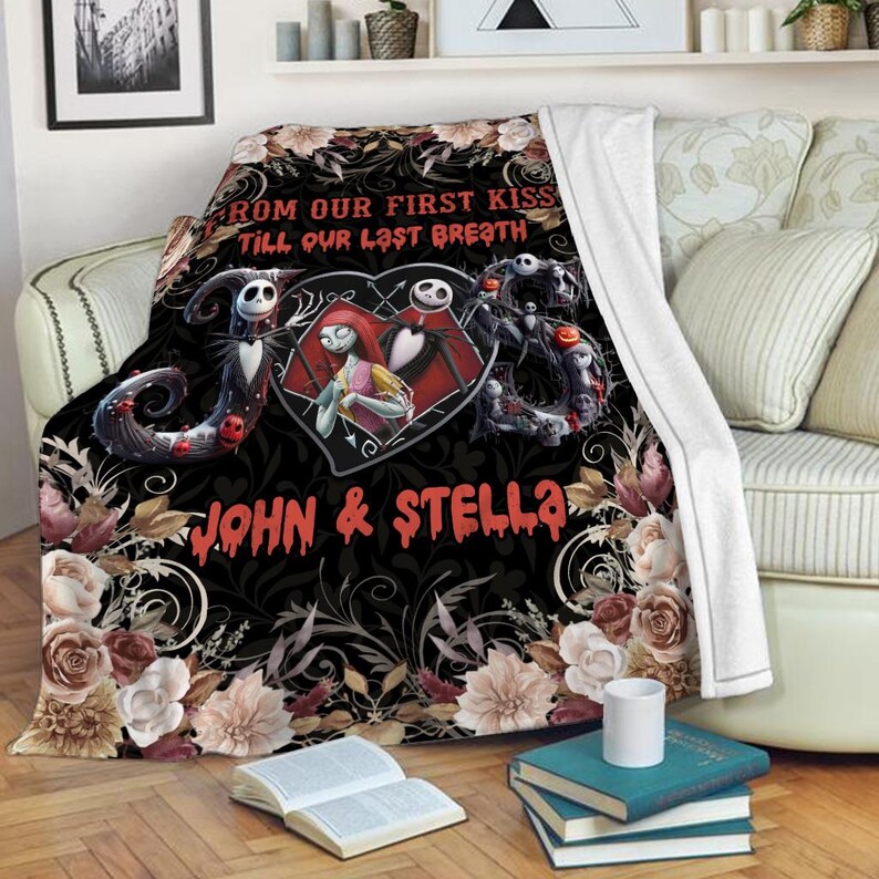 May include: A black fleece blanket featuring a heart-shaped graphic of Jack Skellington and Sally, surrounded by floral patterns and the text FROM OUR FIRST KISS TILL OUR LAST BREATH and JOHN & STELLA in a red, dripping, stylized font.