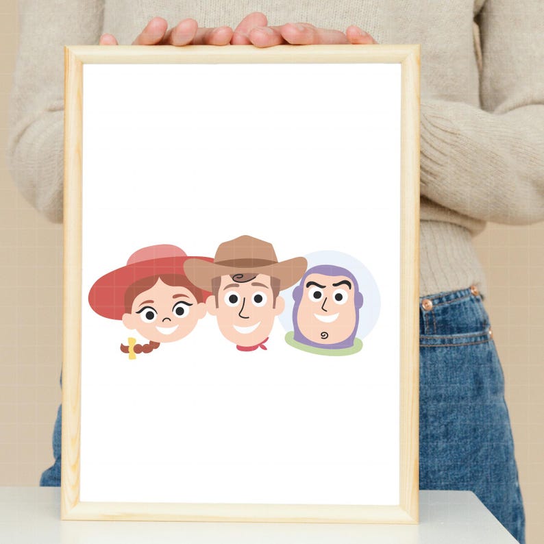 May include: A framed print featuring a minimalist cartoon illustration of three characters. From left to right, the characters include a person with a red hat and brown hair, a person wearing a brown cowboy hat, and a purple and white space character.