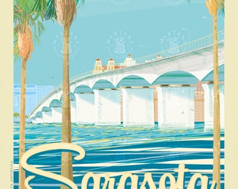 May include: A vintage travel poster featuring a colorful illustration of a bridge over a blue body of water with palm trees in the foreground. The text "Sarasota" is written in a yellow script font and the text "Florida" is written in a black sans-serif font. The poster has a light yellow background.