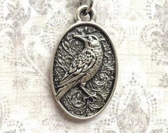 Swirly detailed silver Raven pendant necklace