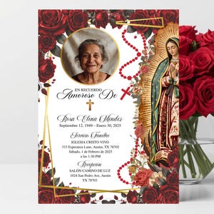 May include: A memorial card with a photo of a woman, surrounded by red roses and gold accents. The card includes text in Spanish, a cross, and an image of the Virgin Mary. A vase of red roses is to the right.
