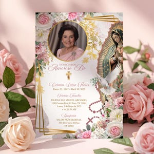 May include: A memorial card with a portrait of a woman, surrounded by floral and religious imagery. The card includes text in Spanish, with dates and locations. Pink and white roses frame the card, set against a soft pink background.