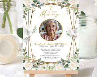 May include: A memorial sign featuring a photo of a woman, surrounded by white roses, greenery, and gold geometric accents. The sign includes the text "In Loving Memory" and the name Eleanor Grace Thompson, with dates and service details.