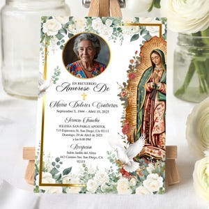 May include: A memorial card with a portrait of a woman, framed by floral and religious elements. The card contains Spanish text, detailing a funeral service and reception. The design includes white doves and roses.
