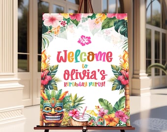 May include: A vibrant welcome sign for a birthday party, with tropical floral decorations, a tiki mask, and a coconut drink. The sign, displayed on a wooden easel, reads "Welcome to Olivia's Birthday Party!" in bright colours.