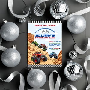 May include: A birthday party invitation with a monster truck theme. The invitation features illustrations of monster trucks on a dirt track, with the text "SMASH AND CRASH!" and "ELIJAH'S 5TH BIRTHDAY BASH!" Silver baubles and ribbons surround the invitation.