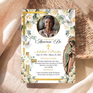 May include: A memorial card with a photo of a woman, surrounded by white roses, doves, and gold accents. The card includes text in Spanish, with the name "Soledad Paredes" and dates "Julio 19, 1944 - Marzo 29, 2025".