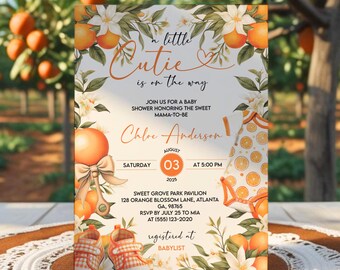 May include: A baby shower invitation with an orange and white theme. The invitation features the text "a little Cutie is on the way" and details for the event, including the date, time, and location. The design includes orange illustrations and floral accents.