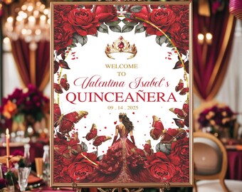 May include: A framed sign with the text "Welcome to Valentina Isabel's Quinceañera" and the date 09.14.2025. The sign features a red dress illustration, butterflies, roses, and a crown. The sign is displayed on a gold easel.
