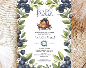 May include: Baby brunch invitation featuring a watercolor design with blueberries and green leaves. The invitation includes text that reads "Baby Brunch for Arielle Ford" and event details. The design includes a stack of pancakes with blueberries.