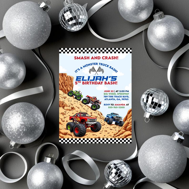 May include: A birthday party invitation with a monster truck theme. The invitation features colorful monster trucks racing on a dirt track, with the text "SMASH AND CRASH!" and "ELIJAH'S 5TH BIRTHDAY BASH!" Silver baubles and ribbon surround the invitation.