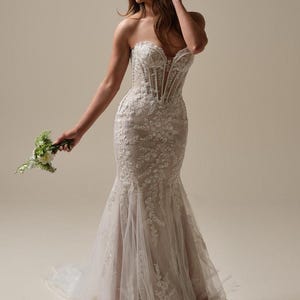 Lacey and beaded mermaid wedding gown