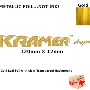 May include: Gold leaf foil sheet with the text "KRAMER™ American" and "120mm x 12mm". The foil has a clear, transparent background.