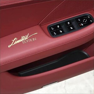 May include: A red leather car door interior with a black door panel and a gold "Limited Edition" inscription.
