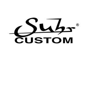 May include: Black and white logo for Suhr Custom, a guitar company. The logo features a stylised cursive font with a line through the middle.