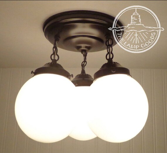 Winterport Ii Ceiling Light Trio Of Milk Glass Globes Flush Image 0