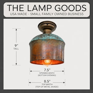 May include: A vintage-style ceiling lamp with a copper-colored shade and a teal-colored top. The lamp is 9 inches tall, with a 7.5-inch opening width and an 8.5-inch top width. The text "THE LAMP GOODS" and "USA MADE - SMALL FAMILY OWNED BUSINESS" are at the top.