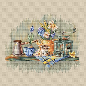 May include: A set of three ceramic mugs with a speckled, matte finish. The mugs are in shades of cream, light gray, and dark gray. Each mug has a simple, minimalist design, perfect for coffee or tea.