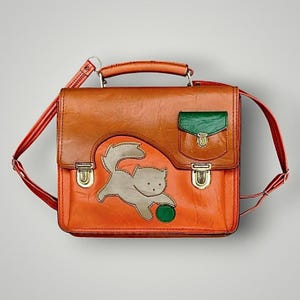 Cartable d’écolier rétro en Skaï orange - motif chat - années 70