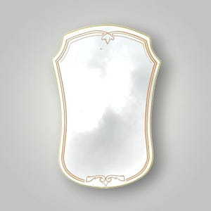 Vintage 60s mirror - Shield shape with gold plastic frame and ornaments - 66 x 45 cm