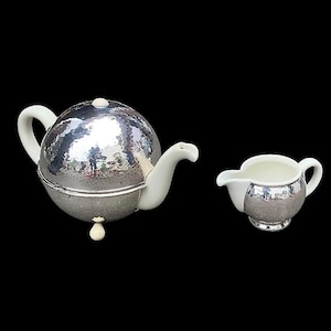 WMF Art Deco teapot and matching milk jug in porcelain and hammered silver-plated metal - 1930s