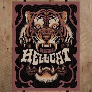 May include: A black and white illustration of a tiger's face with an open mouth, showing sharp teeth. The tiger's face is surrounded by a decorative frame with the word "ELECTRIC HELLCAT" in a stylized font.