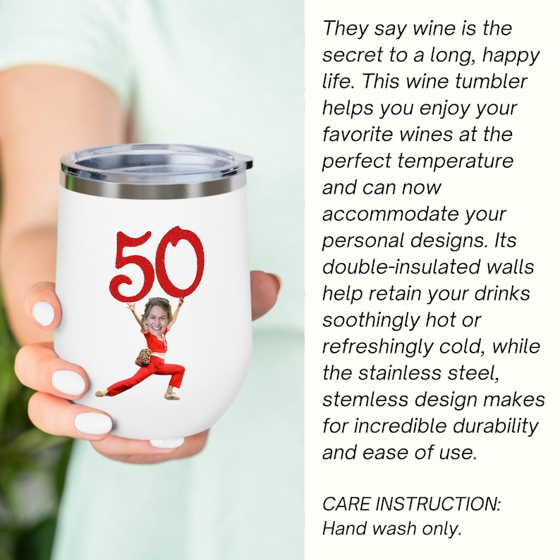 May include: White stemless wine tumbler with a silver rim, featuring a red "50" graphic and a person's image. The tumbler has text that says, "They say wine is the secret to a long, happy life."