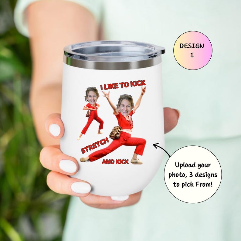 May include: White insulated tumbler with a silver rim and lid. The tumbler features a custom design with a person in a red outfit, with the text "I LIKE TO KICK, STRETCH AND KICK". A design 1 label is also visible.
