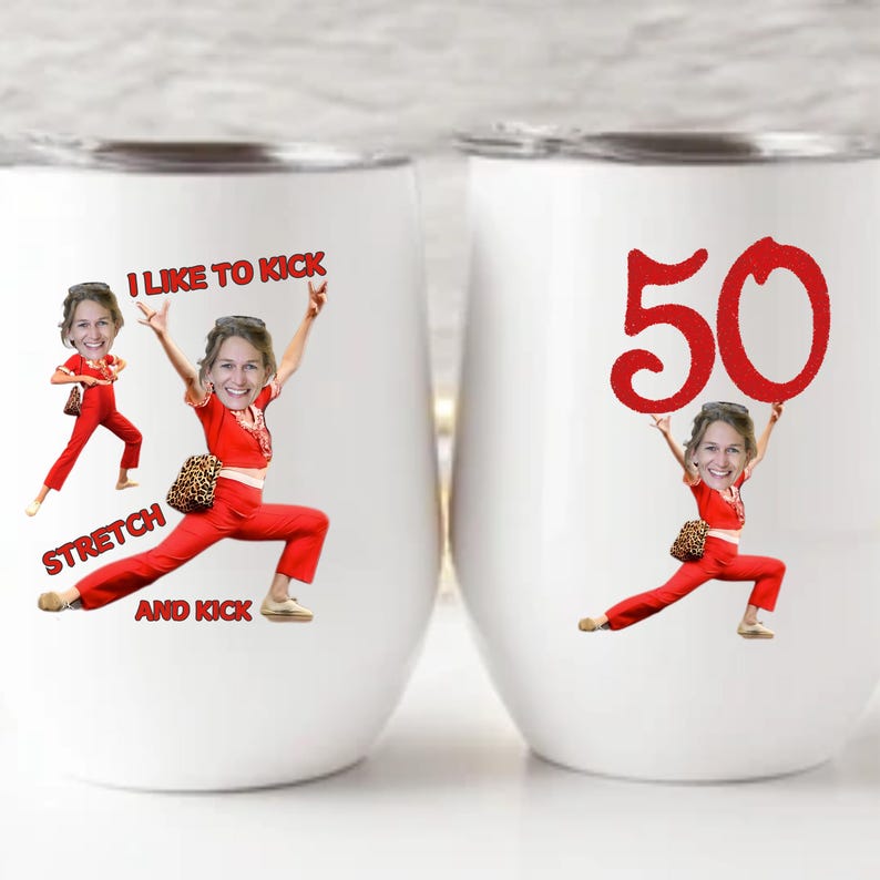 May include: Two white stemless wine tumblers with a red graphic. One tumbler has the text "I LIKE TO KICK STRETCH AND KICK" and a cartoon image. The other has the number "50" and a cartoon image.
