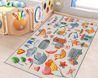 May include: A rectangular children's rug with a cream background and colorful watercolor illustrations. The design includes airplanes, helicopters, animals, hearts, and the word "LOVE". The rug is placed on a light wood floor.