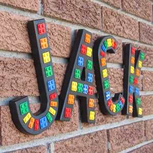 Black "Brick Script" Wall Letters, embedded with real bricks.