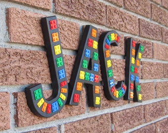 Black "Brick Script" Wall Letters, embedded with real bricks.